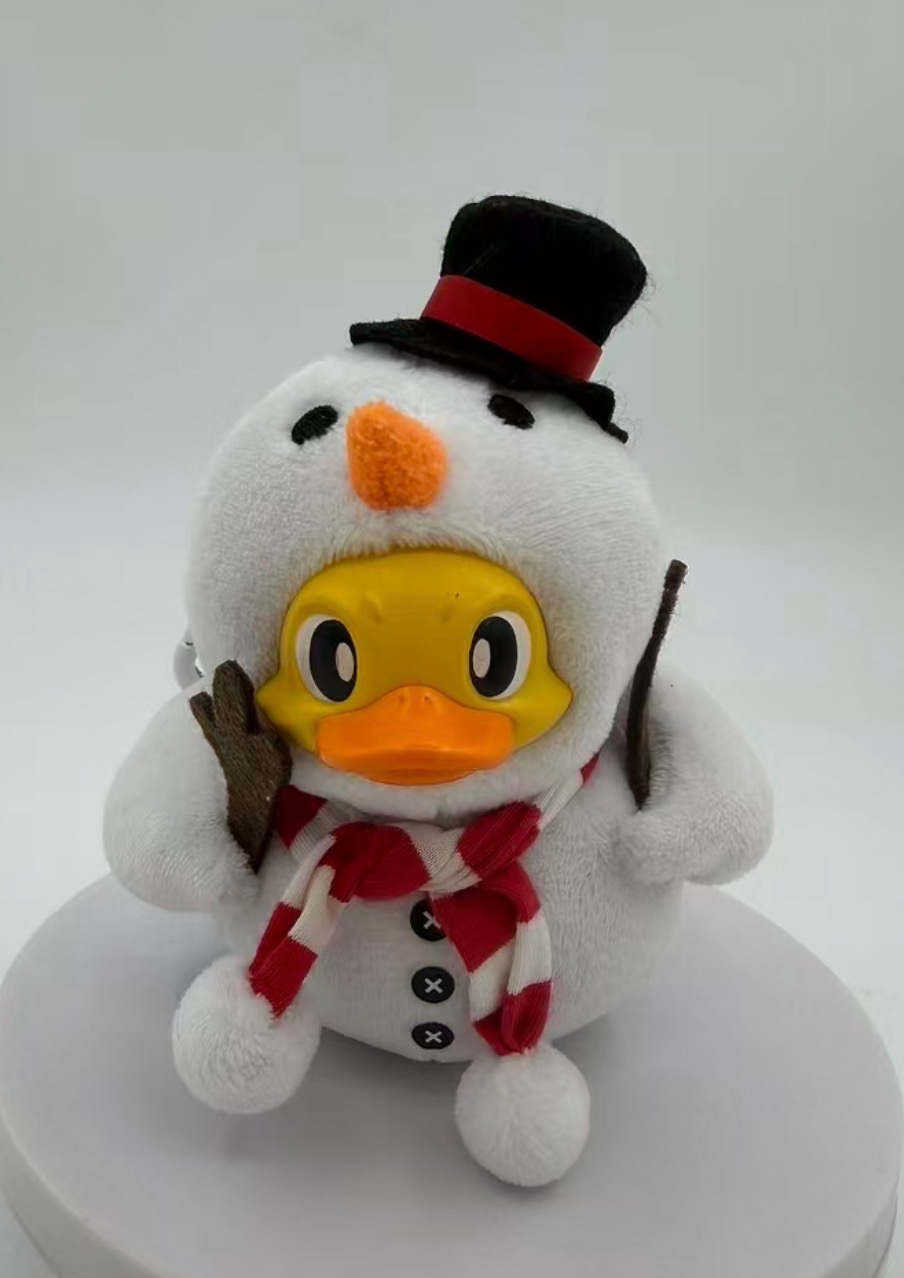 Snowman Duck — top hat, carrot nose, candy-cane scarf